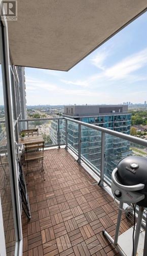 Toronto (Islington-City Centre West) condo for rent - A balcony with a grill and a view of the city.
