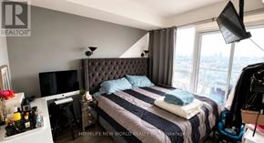 Toronto (Islington-City Centre West) condo for rent - A bedroom with a large bed and a flat screen TV.