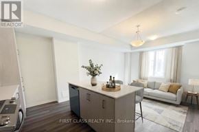Vaughan (Vaughan Corporate Centre) townhouse for rent - A modern living room with a grey cabinet and a grey sofa.