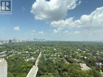 Toronto (North St. James Town) condo for rent - A cityscape with a road running through the middle of it.