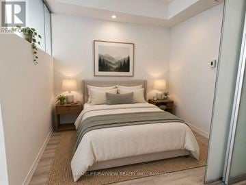 Toronto (Mount Pleasant West) condo for rent - A bedroom with a large bed and a painting on the wall.