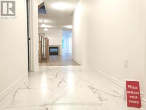 East Gwillimbury (Holland Landing) apartment for rent - A hallway with a sign that says "Please remove your shoes".