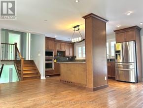 Burlington (Appleby) apartment for rent - A kitchen with wooden floors and a large island.