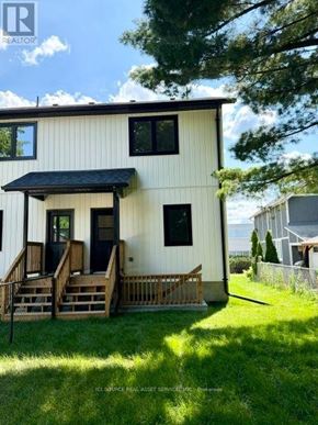 Halton Hills (Georgetown) apartment for rent - A white house with a black roof and a porch.