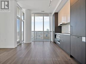 Vaughan (Vaughan Corporate Centre) condo for rent - A modern kitchen with a view of the city.
