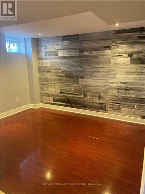 Mississauga (Hurontario) apartment for rent - A room with a wooden floor and a wooden wall.
