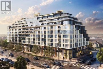 Toronto (Yorkdale-Glen Park) condo for rent - A modern multi-story building with the words "Grand Vista Realty" on the front.