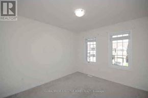 Niagara Falls (Brown) apartment for rent - A white room with a window on the right side.