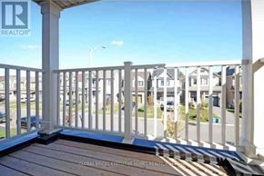 Niagara Falls (Brown) apartment for rent - A white railing with a wooden floor and a blue sky in the background.