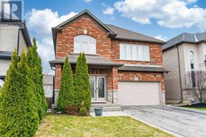 Hamilton (Binbrook) apartment for rent - A house with a red brick exterior and a white garage door.