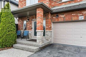 Hamilton (Binbrook) apartment for rent - A house numbered 147 with a white garage door.