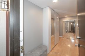 Toronto (Mount Pleasant West) condo for rent - A hallway with a bench and a mirrored door.