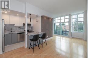 Toronto (Mount Pleasant West) condo for rent - A modern kitchen with a dining area and a view of the outside.