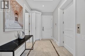 Toronto (Casa Loma) condo for rent - A hallway with white doors and a marble bench.