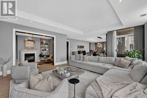 Toronto (Casa Loma) condo for rent - A modern living room with a grey sofa set and a fireplace.