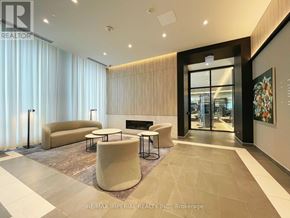 Hamilton (Beasley) condo for rent - A modern living room with a fireplace and a large painting on the wall.