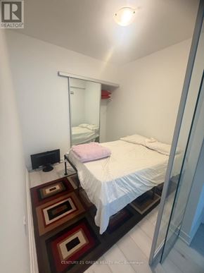 Toronto (Church-Yonge Corridor) condo for rent - A bedroom with a bed, a mirror, and a rug.