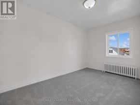Thorold (Thorold Downtown) apartment for rent - A room with a window and a radiator on the floor.