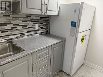 Milton (Sc Scott) apartment for rent - A white refrigerator with a sticker on it is in a kitchen.