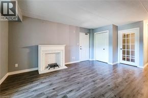 Burlington condo for rent - A living room with a fireplace and wood flooring.