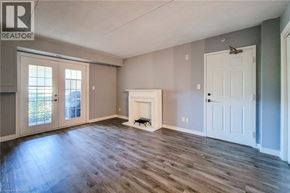 Burlington condo for rent - A room with a fireplace and a white door.