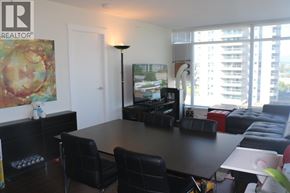 Richmond apartment for rent - A living room with a black table and chairs.