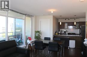 Richmond apartment for rent - A modern kitchen with a dining table and chairs.
