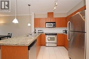 Coquitlam apartment for rent - A kitchen with a granite counter top and stainless steel appliances.