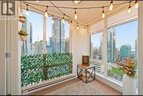 Vancouver apartment for rent - A room with a view of the cityscape through a window with a green wall on the other side.