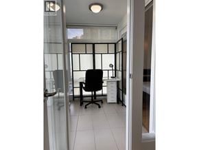 Vancouver apartment for rent - A black chair is in front of a glass partition.
