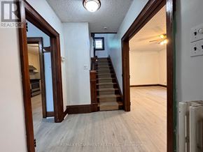 Burlington (Lasalle) apartment for rent - A hallway with a staircase leading to the second floor.