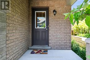 Collingwood townhouse for rent - A house entrance with a door and a window.