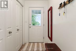Collingwood townhouse for rent - A white door with a glass window is flanked by two white doors.