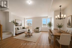 Russell townhouse for rent - A well-lit, spacious dining room with a wooden table and chairs.