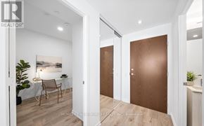 Vaughan (Concord) condo for rent - A realtor image of a home interior with a brown door.
