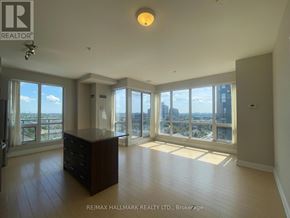 Richmond Hill (South Richvale) condo for rent - A spacious room with a large window overlooking the city.