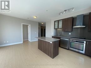 Richmond Hill (South Richvale) condo for rent - A kitchen with a wooden island and stainless steel appliances.