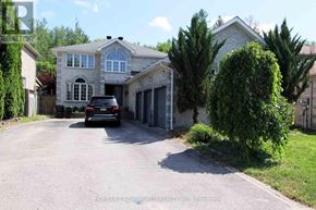 Barrie (Ardagh) apartment for rent - A house with a driveway and a car parked in front.