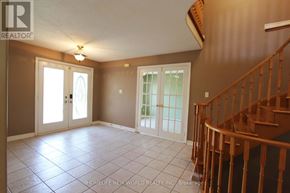Barrie (Ardagh) apartment for rent - A room with a staircase and a door leading to a balcony.