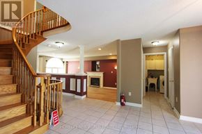 Barrie (Ardagh) apartment for rent - A realtor sign is in the bottom left corner of a spacious living room.