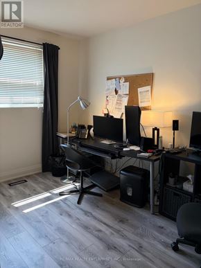 Mississauga (Port Credit) townhouse for rent - A room with a desk, chair, and computer setup.