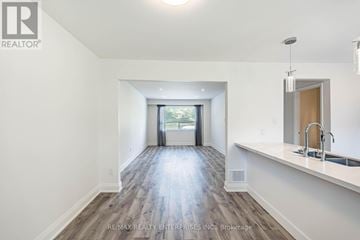 Mississauga (Port Credit) townhouse for rent - A spacious, well-lit kitchen with a sink and a window.