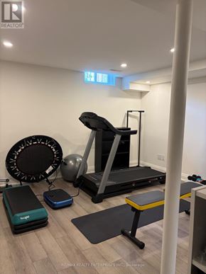 Mississauga (Port Credit) townhouse for rent - A gym room with a treadmill, exercise balls and benches.