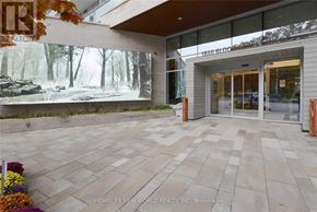 Toronto (High Park North) condo for rent - The entrance to a building with a large mural on the wall.
