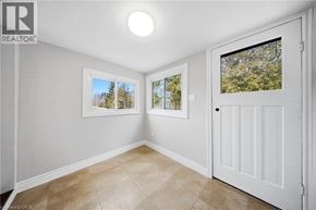 Cambridge apartment for rent - A room with a white door and a window with a view of trees.