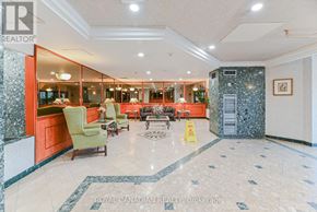 Toronto (Milliken) condo for rent - A spacious lobby with a marble floor and a reception desk.