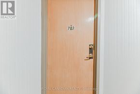 Toronto (Milliken) condo for rent - A door with the number 703 on it.