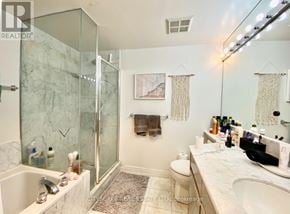 Toronto (Church-Yonge Corridor) condo for rent - A bathroom with a glass shower stall and a marble counter top.