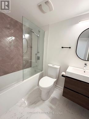 Toronto (Bendale) condo for rent - A bathroom with a toilet, sink, and shower.