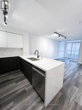Toronto (Bendale) condo for rent - A modern kitchen with a white countertop and a sink.
